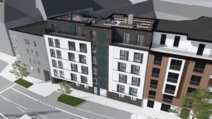 Im Vordergrund ist eine ruhige Straße zu sehen, die das stilvolle Gebäude mit seinen verschiedenen Materialien und Farben umgibt.